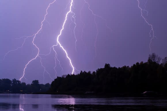 Lightning strike against a purple sky