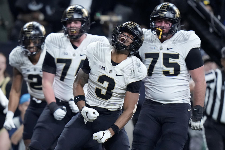 Purdue wide receiver Tyrone Tracy (3) celebrates after running for a 20-yard gain during the first half of the Big Ten championship NCAA college football game against Michigan, Saturday, Dec. 3, 2022, in Indianapolis. (AP Photo/AJ Mast)