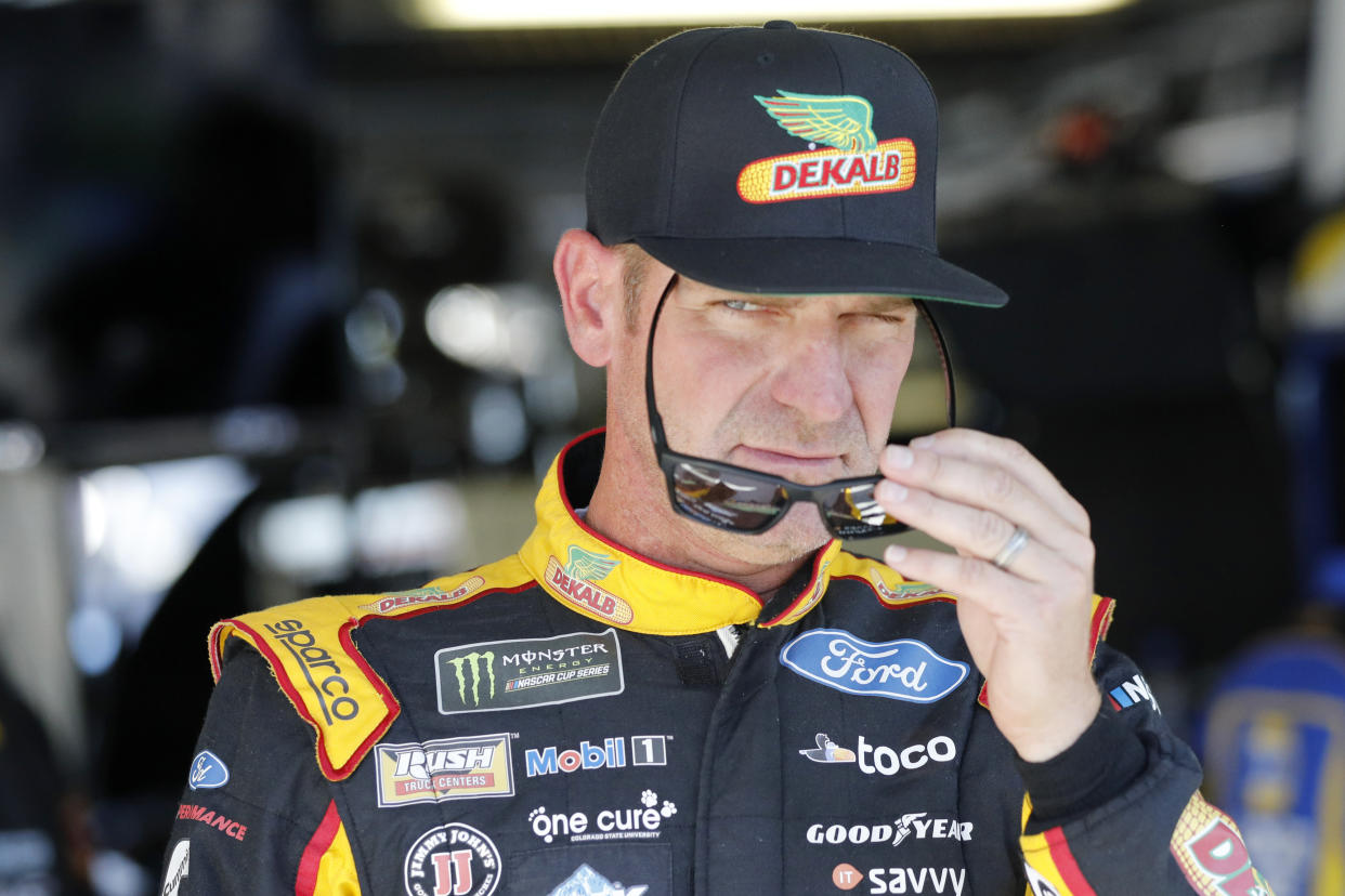 Clint Bowyer walks from the garage area following practice for a NASCAR Cup Series auto race at Kansas Speedway in Kansas City, Kan., Friday, Oct. 18, 2019. (AP Photo/Colin E. Braley)