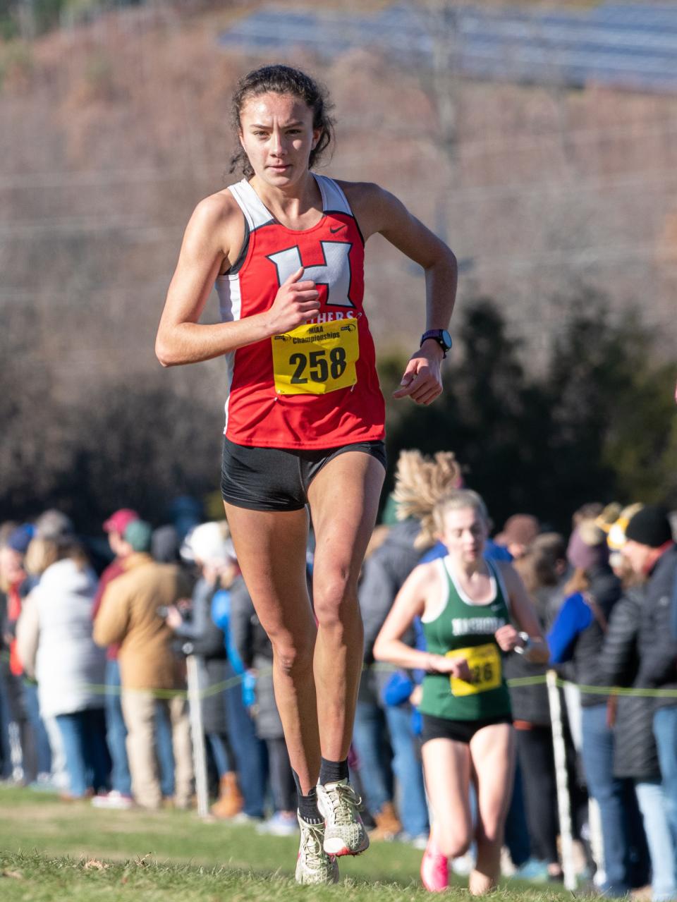 Holliston's Carmen Luisi approaches the finish line with her second consecutive Div. 2 state cross country title at Devens in November.