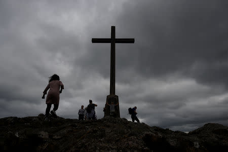 A huge cross is seen overlooking the Eastern Irish coastline of Counties Wicklow and Dublin in Bray, Ireland, August 16, 2018. REUTERS/Clodagh Kilcoyne