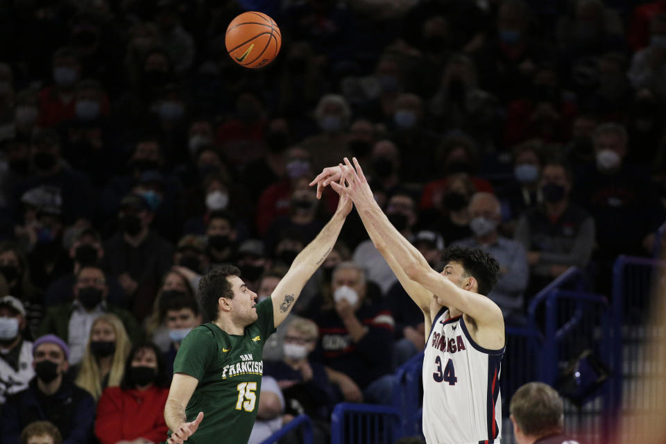 Gonzaga center Chet Holmgren (34) shoots over San Francisco guard Gabe Stefanini (15) during the first half of an NCAA college basketball game, Thursday, Jan. 20, 2022, in Spokane, Wash. (AP Photo/Young Kwak)