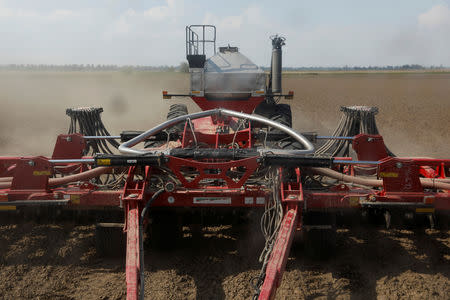 FILE PHOTO: A fertilising mechanism fertilizes soybean fields in Gideon, Missouri, U.S., May 16, 2018. REUTERS/Shannon Stapleton/File Photo