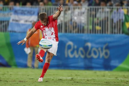 2016 Rio Olympics - Rugby - Men's Quarterfinals - Britain v Argentina - Deodoro Stadium - Rio de Janeiro, Brazil - 10/08/2016. Tom Mitchell (GBR) of United Kingdom kicks a drop penalty which hit the post. REUTERS/Phil Noble