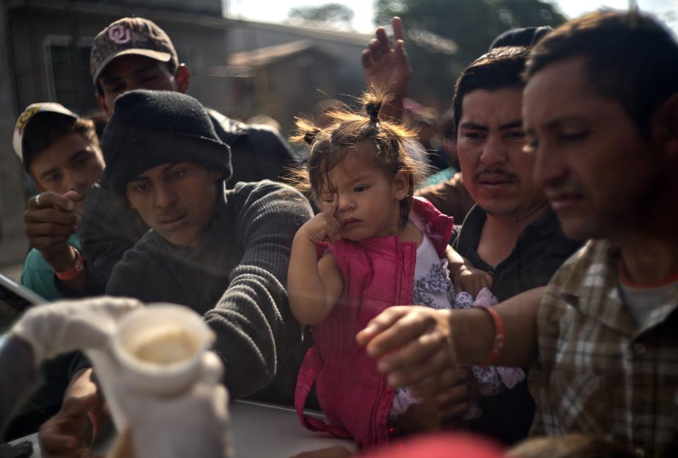 Members of a Central American caravan, stand in a food line at a shelter in Tijuana, Mexico, Tuesday, Nov. 20, 2018. U.S. border inspectors are processing only about 100 asylum claims a day at Tijuana's main crossing to San Diego, and there was already a waiting list of 3,000 when the new migrants arrived, so most will have to wait months to even be considered for asylum. (AP Photo/Ramon Espinosa)