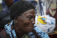 A relative grieves as she waits to collect the bodies of villagers who were killed by suspected rebels as they retreated from Saturday's attack on the Lhubiriha Secondary School, outside the mortuary of the hospital in Bwera, Uganda Sunday, June 18, 2023. Ugandan authorities have recovered the bodies of 41 people including 38 students who were burned, shot or hacked to death after suspected rebels attacked the school in Mpondwe near the border with Congo, according to the local mayor. (AP Photo/Hajarah Nalwadda)