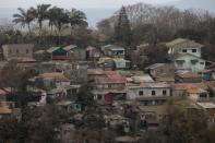 Houses covered in ash following Taal Volcano's eruption are pictured in Tagaytay City