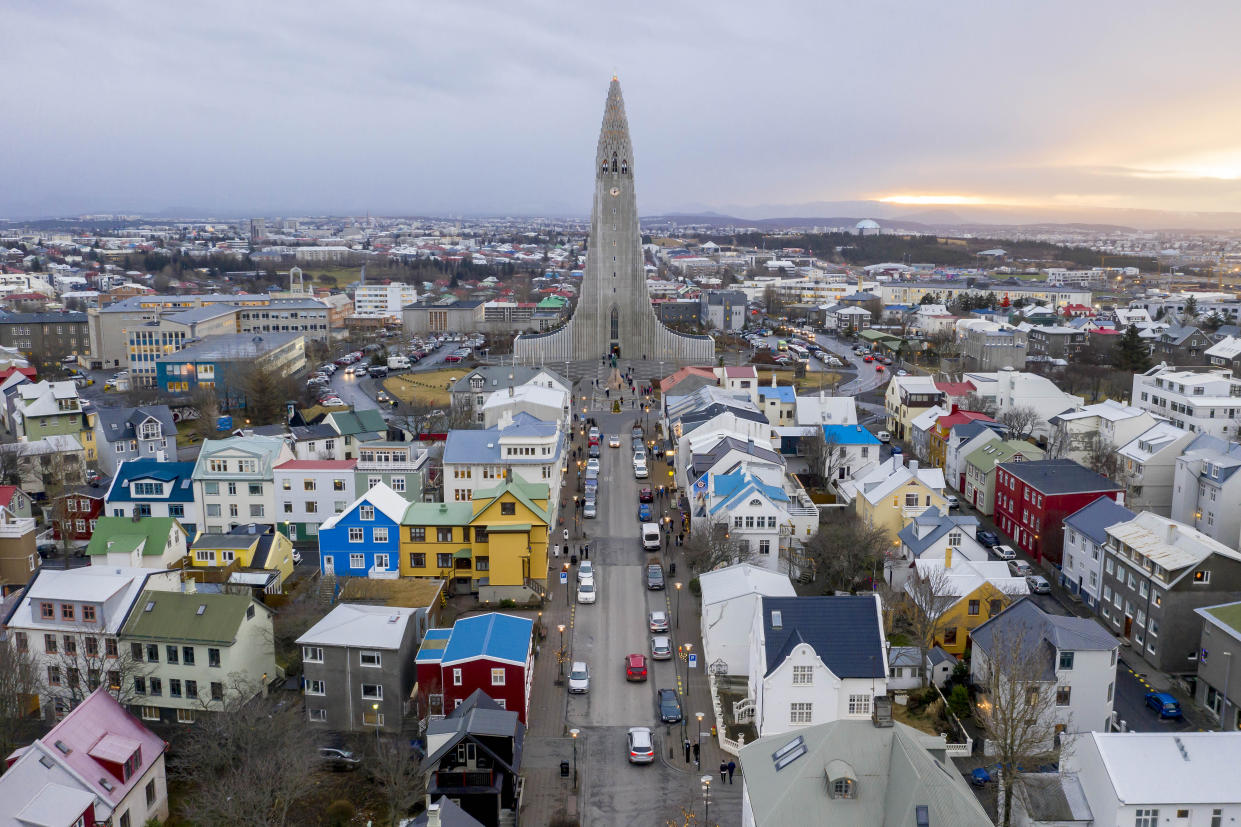 FILE PHOTO: Wide landscape views of buildings, cars, people, homes, apartments, mountains, streets, water, and businesses are seen in Reykjavik, Iceland on December 18, 2018. The Hallgrimskirkja church is predominately centered in the capital, which is the largest city of the island of Iceland.  (Photo by Patrick Gorski/NurPhoto via Getty Images)