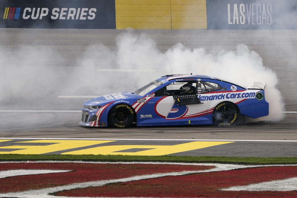 Kyle Larson does a burnout after winning a NASCAR Cup Series auto race Sunday, March 7, 2021, in Las Vegas. (AP Photo/John Locher)