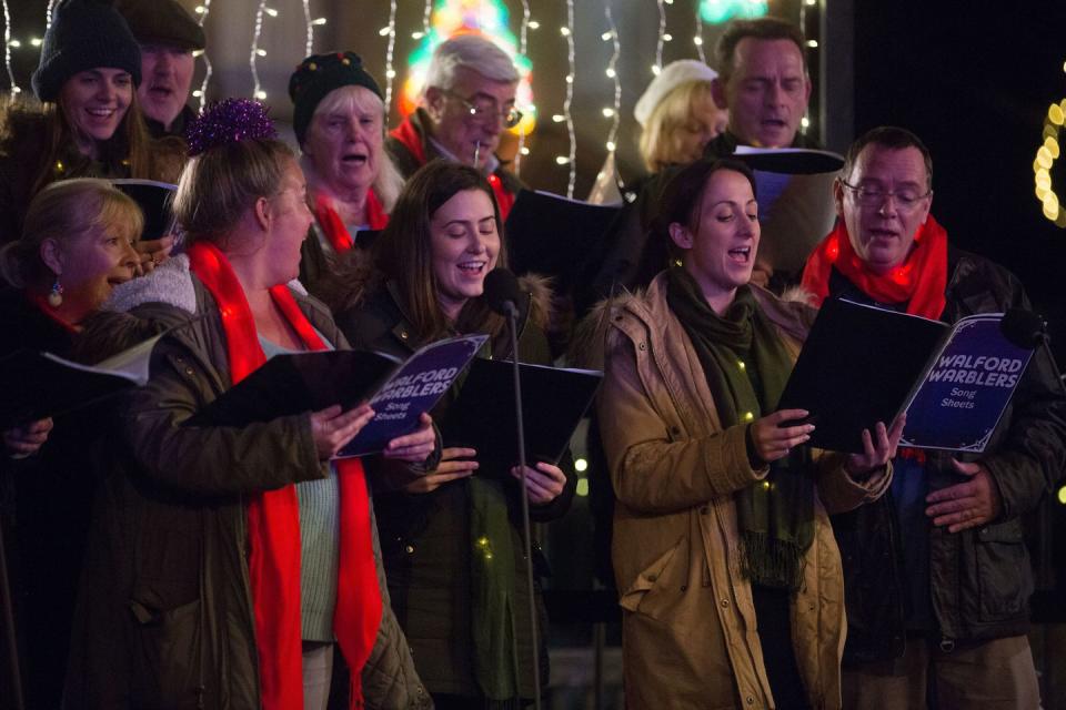 Monday, December 24: The choir help to get everyone in the Christmas spirit