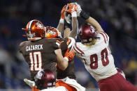 New Mexico State linebacker Trevor Brohard, right, intercepts a pass against Bowling Green tight end Levi Gazarek (10) and wide receiver Odieu Hiliare, center, during the first half of the Quick Lane Bowl NCAA college football game, Monday, Dec. 26, 2022, in Detroit. (AP Photo/Al Goldis)
