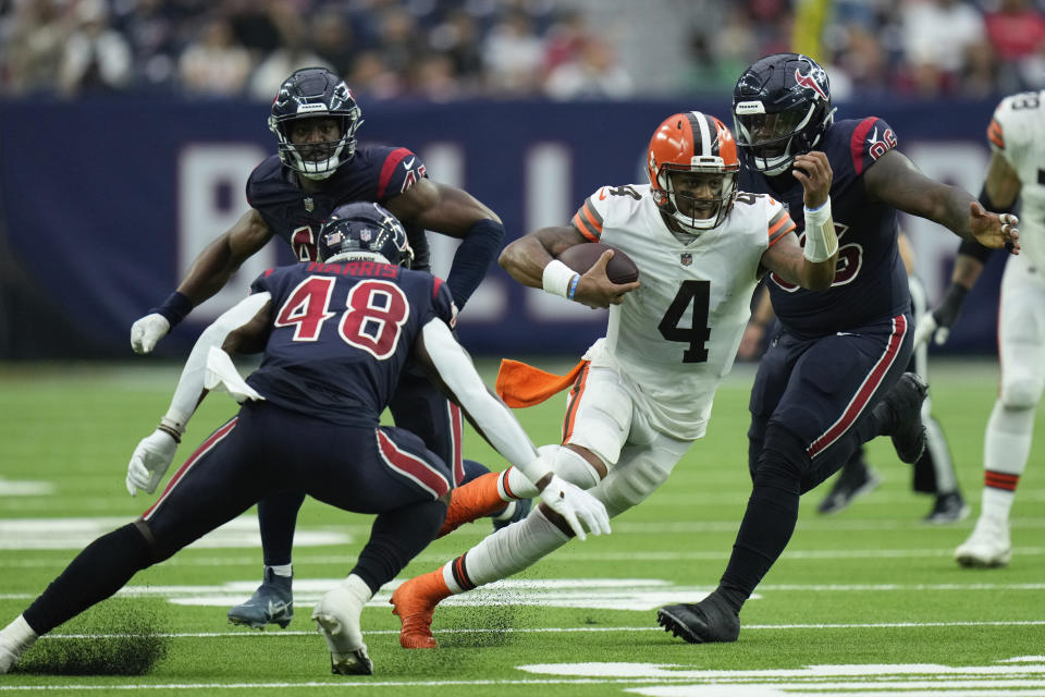 Cleveland Browns quarterback Deshaun Watson (4) runs through the Texans' defense during the second half of an NFL football game between the Cleveland Browns and Houston Texans in Houston, Sunday, Dec. 4, 2022. (AP Photo/Eric Christian Smith)