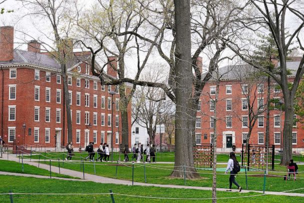 PHOTO: Students walk through Harvard Yard on the campus of Harvard University in Cambridge, Mass., April 27, 2022. (Charles Krupa/AP, FILE)