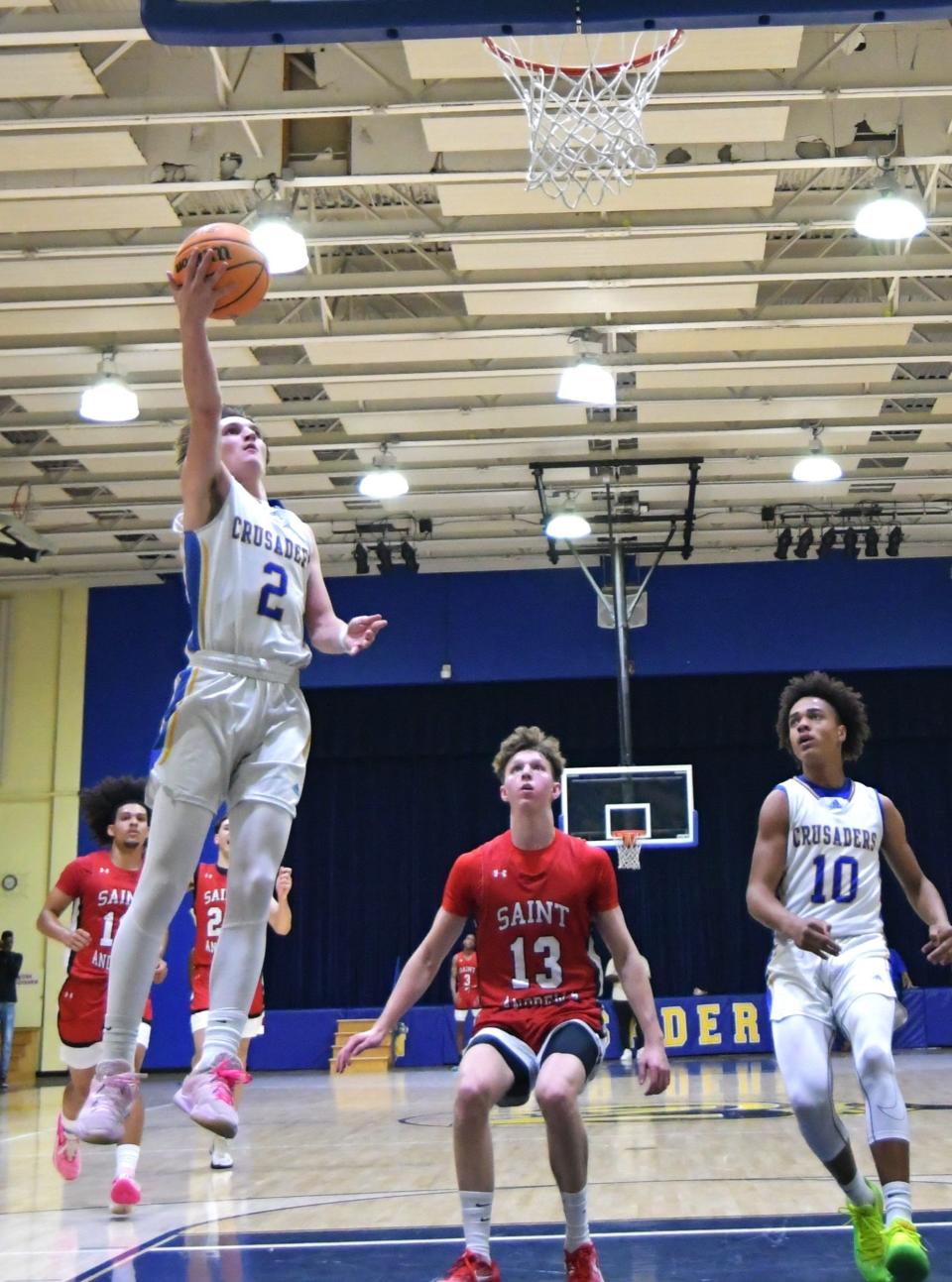 Cardinal Newman point guard Joe Duran (2) goes high for a lay up during a game against Saint Andrews on Jan. 309, 2024.