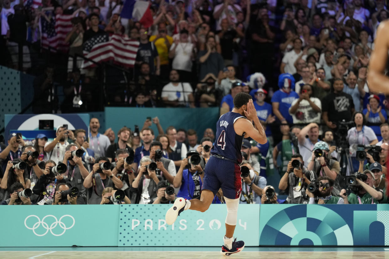 FILE - United States' Stephen Curry (4) celebrates after beating France to win the gold medal during a men's gold medal basketball game at Bercy Arena at the 2024 Summer Olympics, Aug. 10, 2024, in Paris, France. (AP Photo/Mark J. Terrill, File)