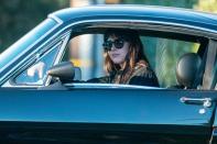 <p>Dakota Johnson hits the brakes on Saturday while out for a drive in Malibu.</p>