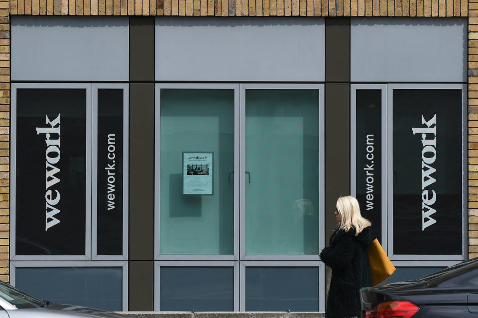 A lady passes outside WeWork offices, an American company that provides shared workspaces for technology startup, subculture communities, and services for entrepreneurs, freelancers, startups, small businesses and large enterprises. On Tuesday, May 7, 2019, in Dublin, Ireland. (Photo by Artur Widak/NurPhoto via Getty Images)