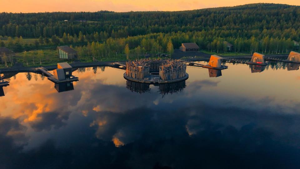 a lake with a dock and trees