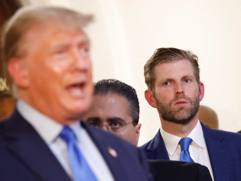 Eric Trump looks at Donald Trump