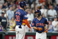 Houston Astros' Jose Altuve, right, celebrates his solo home run against the Toronto Blue Jays with Kyle Tucker during the fourth inning of a baseball game Tuesday, April 2, 2024, in Houston. (AP Photo/Eric Christian Smith)
