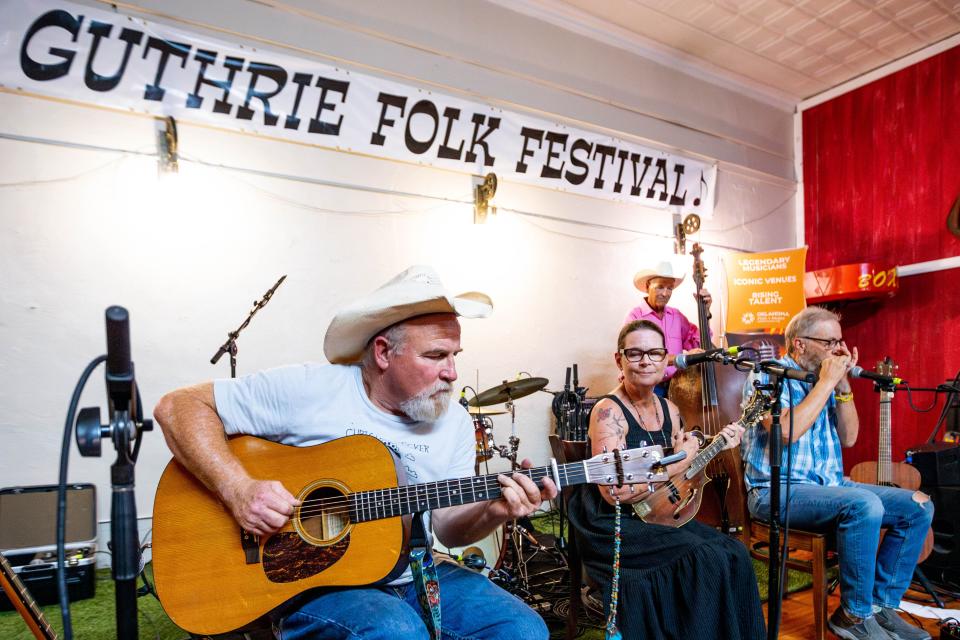 Kurt Nielsen, Sarah Barker Huhn, John Williams and Steve Huhn, of Gypsy Twang, perform Thursday at the 26th Annual Woody Guthrie Folk Festival in Okemah.