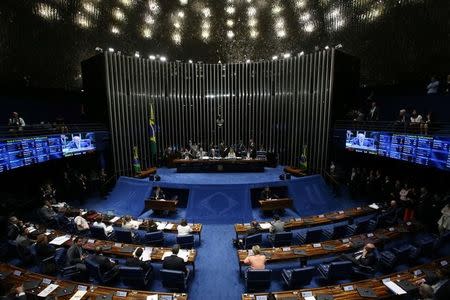 President of Brazil's Supreme Court, Ricardo Lewandowski and Brazil's Senate President Renan Calheiros speak during a discussion before the Senate votes on whether suspended President Dilma Rousseff should stand trial for impeachment, in Brasilia, Brazil, August 9, 2016. REUTERS/Adriano Machado