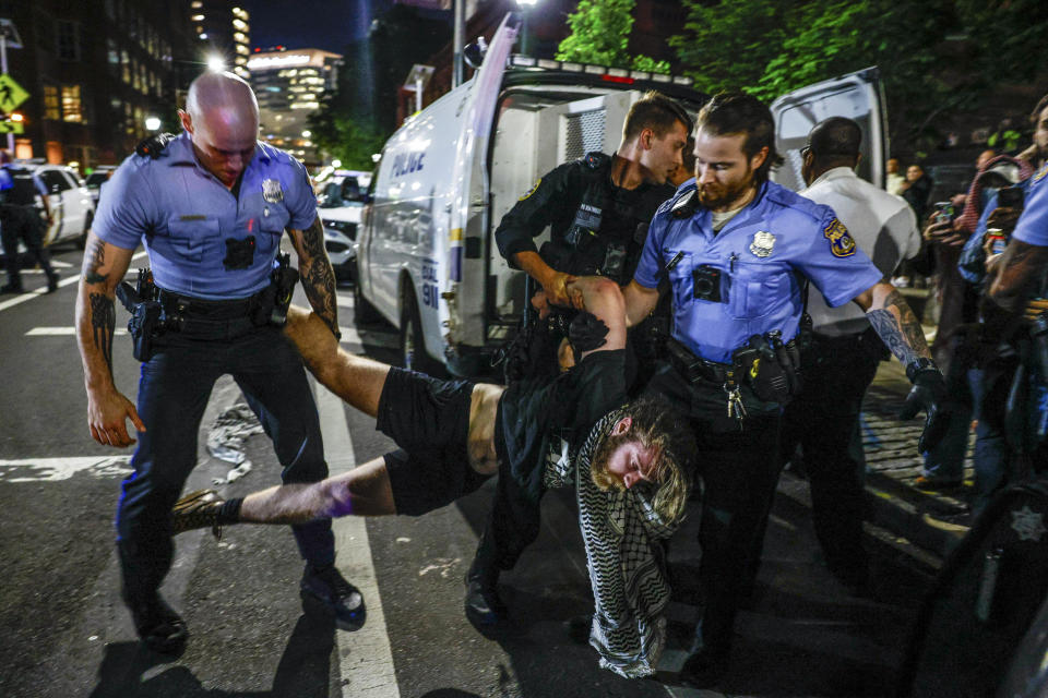 A protester is taken into custody at S. 34th St. near the University of Pennsylvania campus in Philadelphia on Friday, May 17, 2024. Authorities say a half-dozen University of Pennsylvania students were among 19 pro-Palestinian protesters arrested during an attempt to occupy a building on campus. University police say seven remained in custody Saturday awaiting felony charges from Friday's incident, including one person who allegedly assaulted an officer. (Steven M. Falk/The Philadelphia Inquirer via AP)