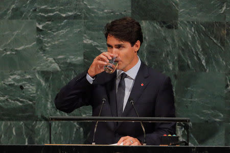 Canadian Prime Minister, Justin Trudeau, takes a drink as he addresses the 72nd United Nations General Assembly at U.N. headquarters in New York, U.S., September 21, 2017. REUTERS/Lucas Jackson