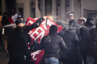 Riot police use pepper spray and rubber bullets against protesters during a demonstration against the World Economic Forum (WEF) in Zurich, Switzerland, Friday, May 20, 2022. The World Economic Forum Annual Meeting will take place from May 22-26, in Davos. (Michael Buholzer/Keystone via AP)