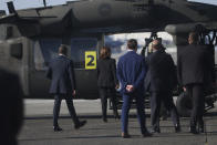 U.S. Vice President Kamala Harris, second left, walks to board a helicopter at Yokota Air Base on the outskirts of Tokyo Monday, Sept. 26, 2022. (Leah Millis/Pool Photo via AP)