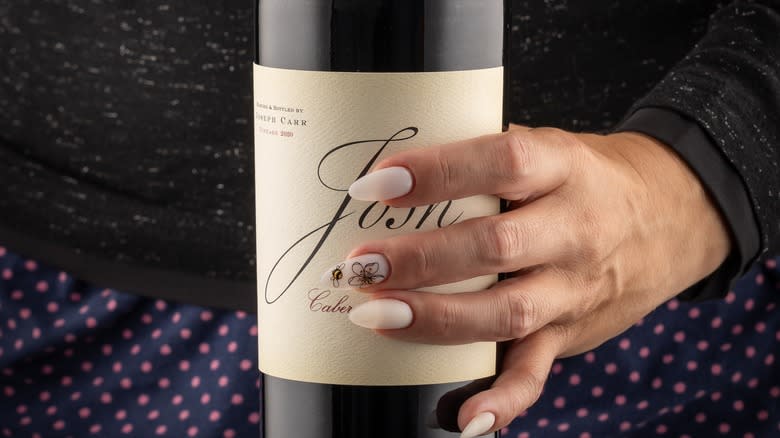 Hand holding bottle of Josh wine