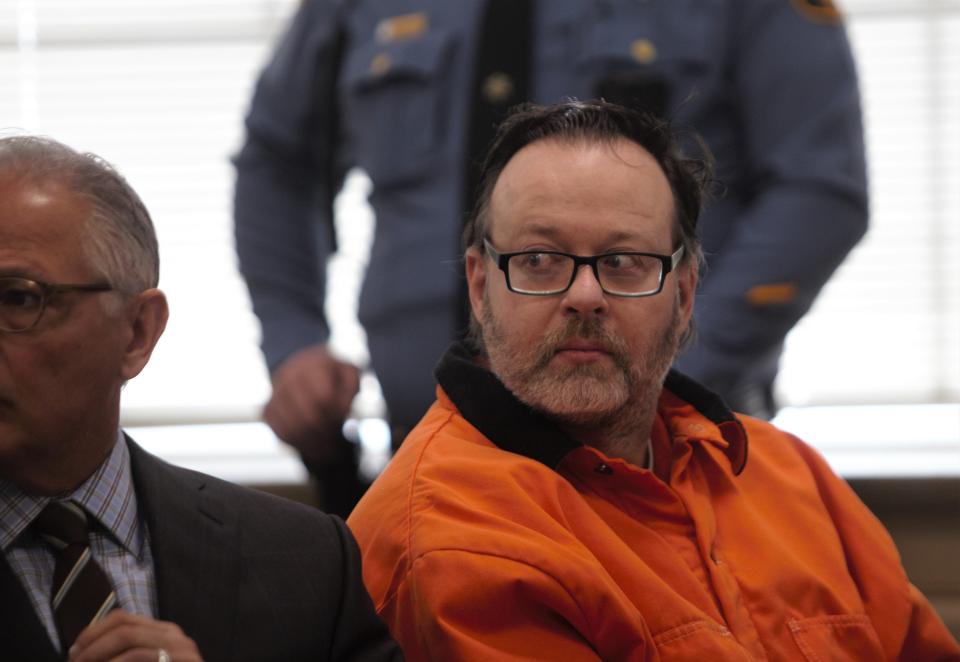 John Formisano, a former Newark cop convicted of killing his estranged wife and wounding her boyfriend in 2019, listens as family gives heart-wrenching testimony during his sentencing on Monday, Dec. 19, 2022. Formisano, who was sentenced to 79 years in prison, sits next to his attorney Anthony Iacullo.