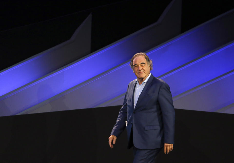 American filmmaker Oliver Stone prepares to speak during the Future Investment Initiative forum in Riyadh, Saudi Arabia, Wednesday, Oct. 30, 2019. Stone praised Russian President Vladimir Putin as a "stabilizing force" in the Middle East. Stone, who made the documentary "The Putin Interviews," made the comment Wednesday during an appearance at the forum. Activists say Russian airstrikes have repeatedly targeted hospitals and civilian sites in Syria's war, something Moscow denies. (AP Photo/Amr Nabil)