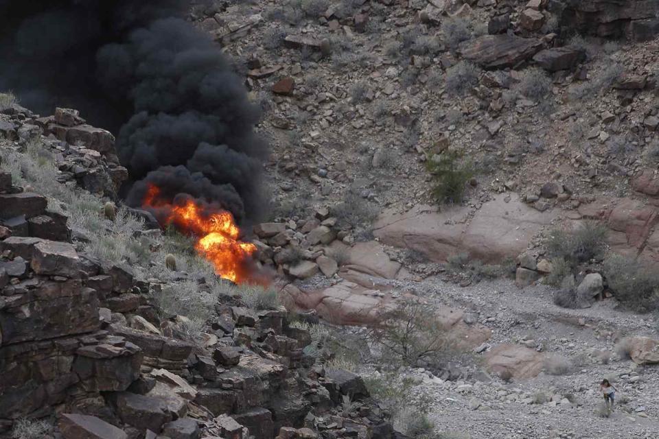 <p>Teddy Fujimoto via AP</p> A tour helicopter crash in the Grand Canyon