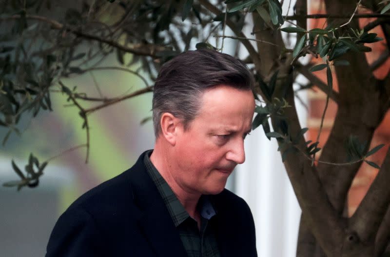 FILE PHOTO: Former British Prime Minister David Cameron leaves his home in London