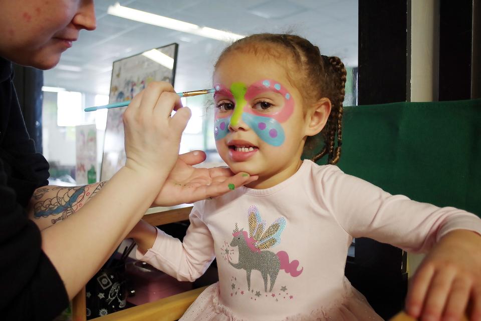 Samara Robinson, 4, of East Bridgewater, gets her face painted by Kayleigh Fortune, of Weymouth, at the Minnie Mouse Valentine's Day Party at the Stay 'N Play Children's Museum in Bridgewater on Sunday, Feb. 12, 2023.