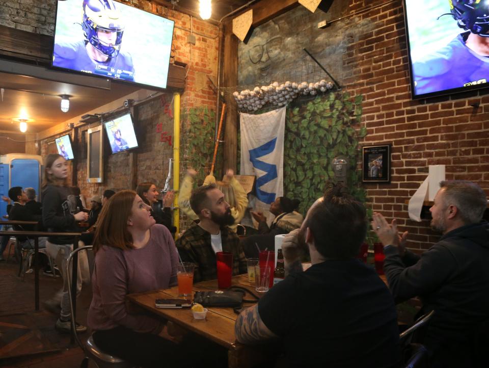 Fans at DT Kirby's cheer as after the Purdue University Boilermakers scored a field goal during the third quarter of the Big Ten Championship match, on Saturday, Dec. 3, 2022, in Lafayette, Ind.