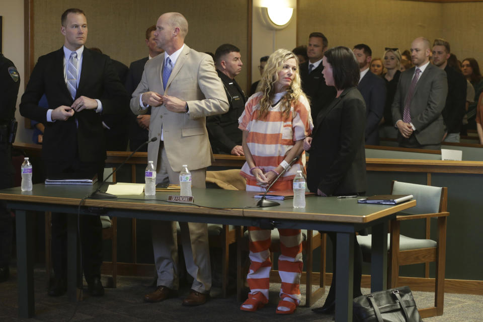 Lori Vallow Daybell, front, second right, and her defense team wait to leave the courtroom during her hearing on Friday, March 6, 2020, in Rexburg, Idaho. Daybell who is charged with felony child abandonment after her two children went missing nearly six months ago had her bond reduced to $1 million by an Idaho judge on Friday. (John Roark/The Idaho Post-Register via AP, Pool)