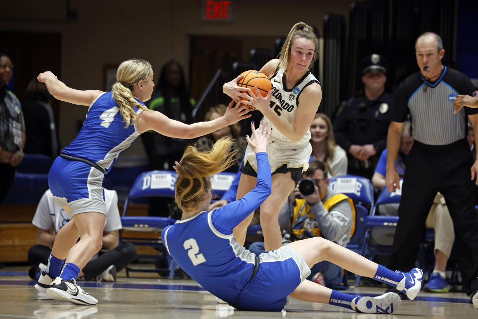 Colorado's Kindyll Wetta (15) grabs the loose ball near Middle Tennessee State's Savannah Wheeler (4) and Anastasiia Boldyreva (2) during the first half of a first-round college basketball game in the NCAA Tournament, Saturday, March 18, 2023, in Durham, N.C. (AP Photo/Karl B. DeBlaker)