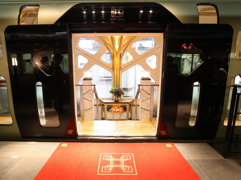 This picture taken on March 16, 2017 shows an entrance of the Train Suite Shiki-Shima, operated by East Japan Railway, in Tokyo during a press preview. The luxury sleeper Shiki-Shima, which can accommodate up to 34 passengers, has 10 cars, including a lounge car, a dining car and two observatory cars. The train has only 17 cabins, all suites, and the most expensive room, known as Shiki-Shima Suite, is priced at 950,000 yen (8480 USD) per person when shared by two people.