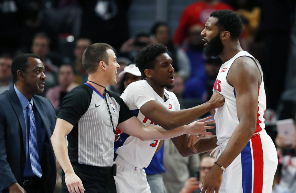 Detroit Pistons guard Langston Galloway holds back center Andre Drummond after Minnesota Timberwolves forward Taj Gibson fouled Drummond during the second half of an NBA basketball game against the Minnesota Timberwolves, Wednesday, March 6, 2019, in Detroit. Gibson was ejected from the game. (AP Photo/Carlos Osorio)