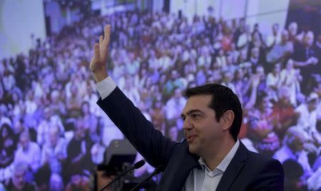 Greek former Prime Minister Alexis Tsipras waves during a meeting with members of his Syriza party in Athens, August 29, 2015. REUTERS/Stoyan Nenov