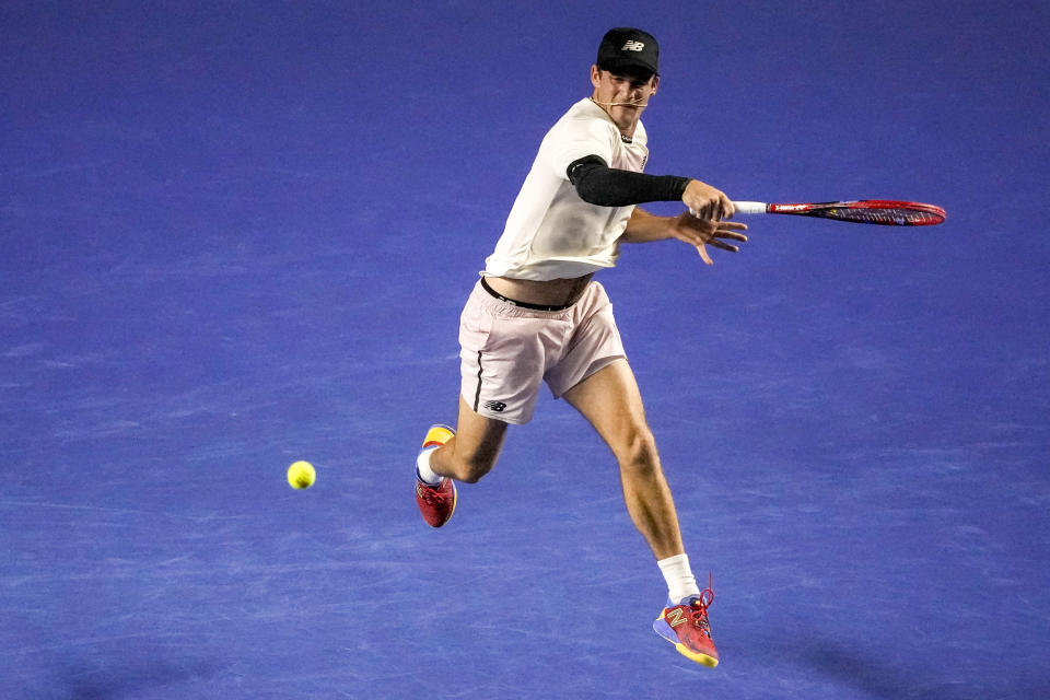 Tommy Paul of the United States returns the ball to Taylor Fritz of the United States during their semifinal match at the Mexican Open tennis tournament in Acapulco, Mexico, Friday, March 3, 2023. (AP Photo/Eduardo Verdugo)