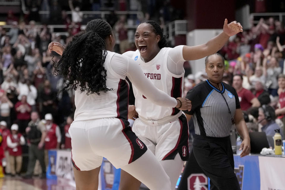 Stanford forward Nunu Agara, facing, and forward Kiki Iriafen celebrate after Stanford defeated Iowa State in overtime of a second-round college basketball game in the women's NCAA Tournament in Stanford, Calif., Sunday, March 24, 2024. (AP Photo/Jeff Chiu)