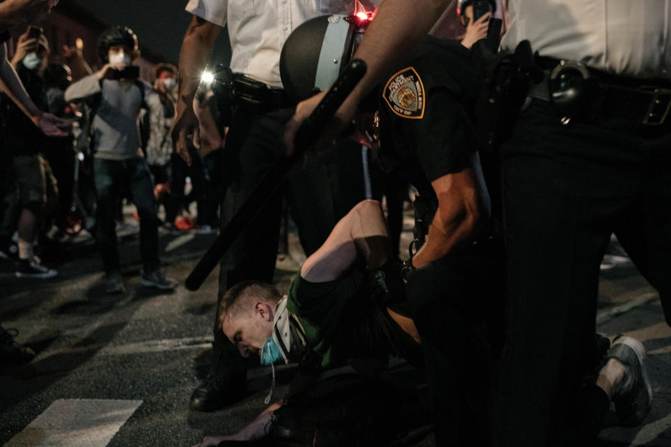 An NYPD officer wrestles a protester to the ground on June 4, 2020, in New York City. / Credit: Scott Heins / Getty