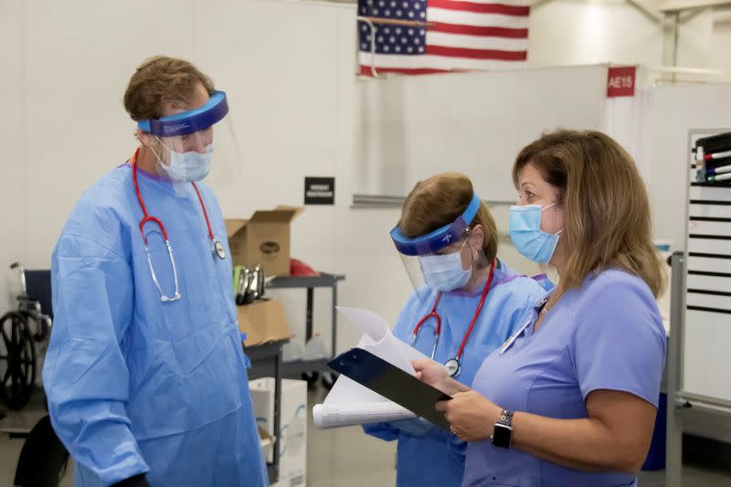 FILE PHOTO: Medical personnel work inside a field hospital known as an Alternate Care Facility at the state fair ground as cases of coronavirus disease (COVID-19) cases spike in the state near Milwaukee, Wisconsin