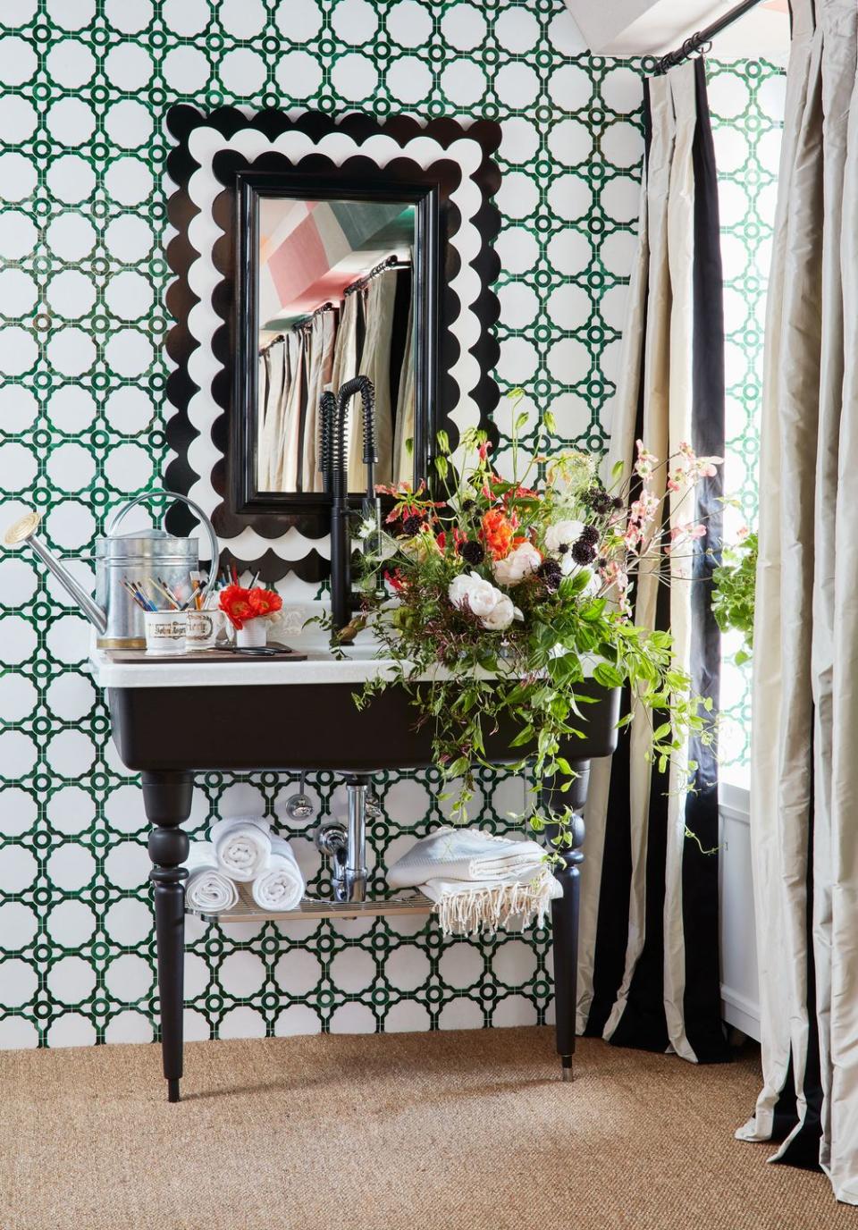 <p>In her bathroom at the <a href="https://www.housebeautiful.com/design-inspiration/house-tours/g27334515/kips-bay-showhouse-2019/" rel="nofollow noopener" target="_blank" data-ylk="slk:Kips Bay show house,;elm:context_link;itc:0;sec:content-canvas" class="link ">Kips Bay show house,</a> designer Young Huh created an artful statement using her AKDO tiles in green and white plus a black-and-white mirror and sculptural black sink. Oh, and a bouquet of flowers never hurts! </p>