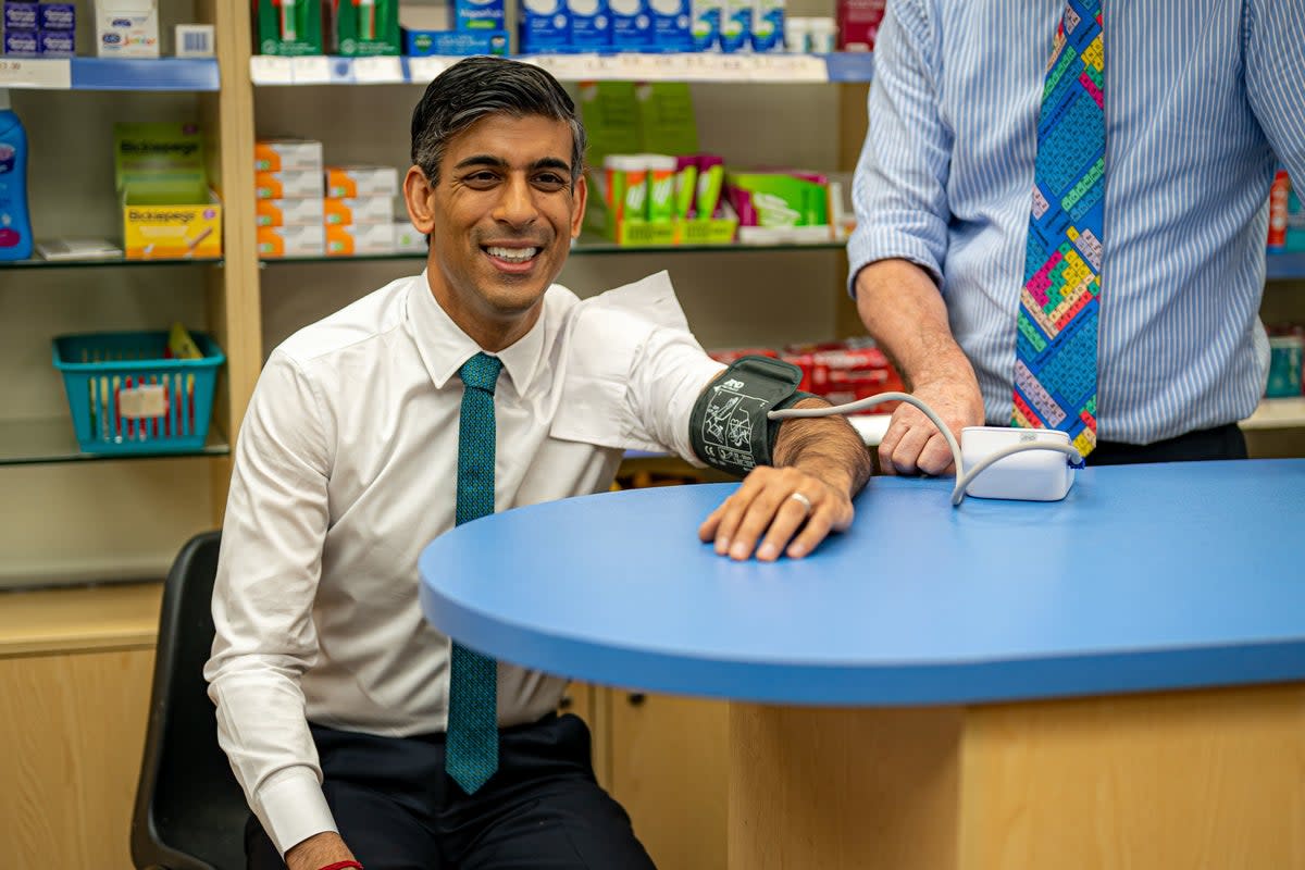Rishi Sunak has his blood pressure checked by a pharmacist during a visit to a GP surgery and pharmacy in Weston, Southampton (PA)