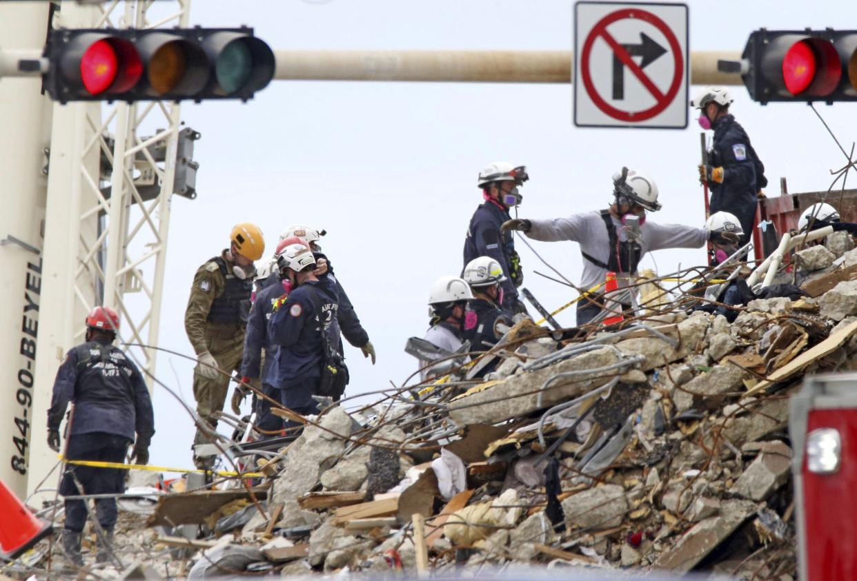 Crews continue working at the site of the Champlain Towers South condo building collapse in Surfside, Fla. on Tuesday, June 29, 2021. The building collapsed early Thursday, trapping over 150 victims.