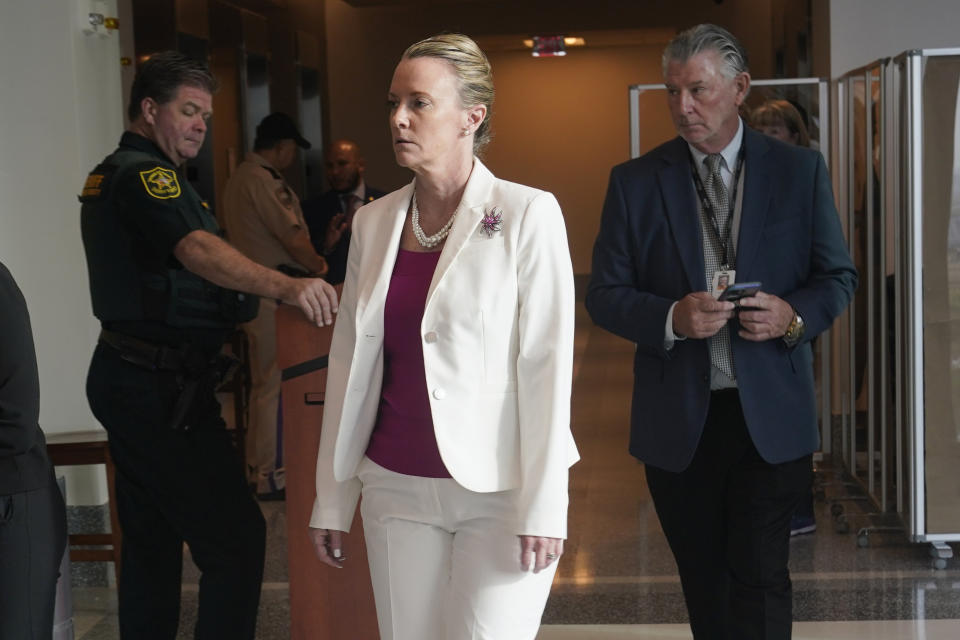 Assistant Public Defender Melisa McNeill enters the a courtroom at the Broward County Courthouse, Tuesday, Oct. 11, 2022, in Fort Lauderdale, Fla. Closing arguments are expected in the penalty trial of Florida school shooter Nikolas Cruz, who faces a possible death sentence for murdering 17 people at Parkland's Marjory Stoneman Douglas High School more than four years ago. (AP Photo/Marta Lavandier, Pool)